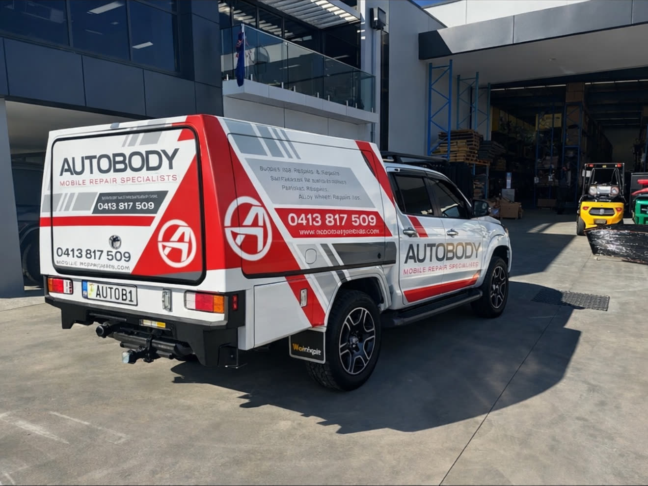 Sydney Autobody mobile repair ute — red and white AB Autobody canopy, phone 0413 817 509